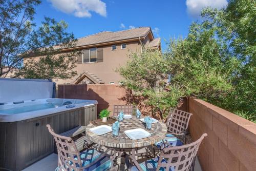 a patio with a table and chairs and a hot tub at 4194 Coral Ridge Resort Dog Friendly, BBQ grill, Private Hot Tub, Community Pool in Washington