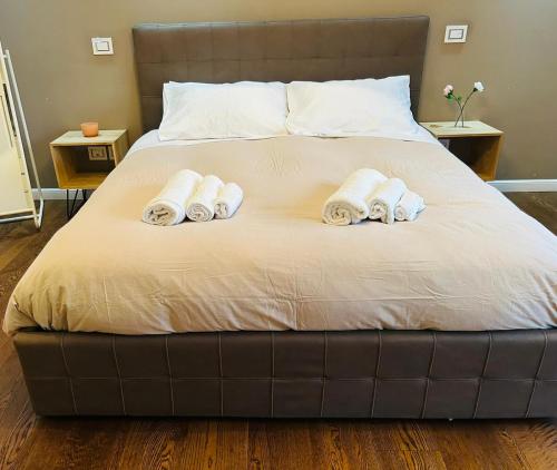 a bedroom with a bed with three towels on it at Morivione Apartment - Bocconi free parking in Milan
