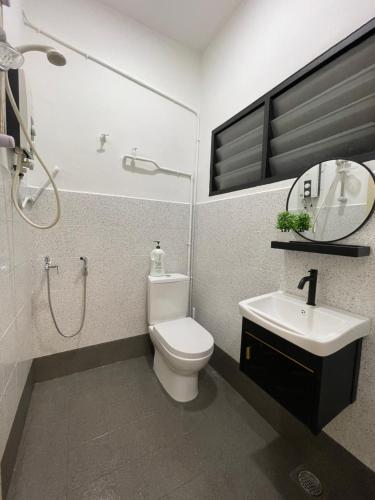 a bathroom with a toilet and a sink and a shower at Ipoh 42 Symphony 12pax 4Bedroom 3bathroom 3carpark in Ipoh