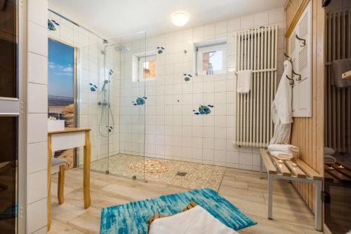 a bathroom with a shower and a sink at Seebrise Zingst in Zingst
