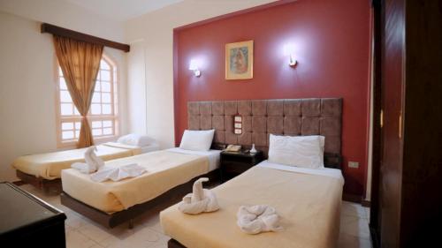 Llit o llits en una habitació de New Sunset Resort