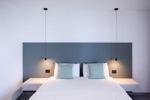 Ένα ή περισσότερα κρεβάτια σε δωμάτιο στο Villa la Matta Apartments and Luxury suites