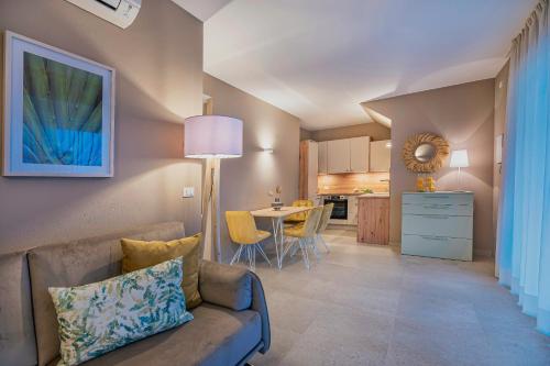 a living room with a couch and a table at Indigo Eco Apartments in Bardolino