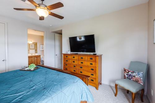 a bedroom with a bed and a flat screen tv at Las Palmas 1805 Shared Pool and Hot Tub, Great Clubhouse Amenities in St. George