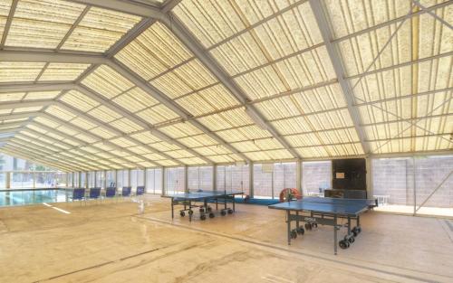 a large room with two ping pong tables in it at Las Palmas 1805 Shared Pool and Hot Tub, Great Clubhouse Amenities in St. George