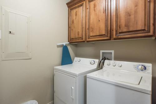 a white washer and dryer in a small bathroom at 2012 LP PS4, Private Balcony with Beautiful Mountain Views, and Great Clubhouse Amenities in St. George