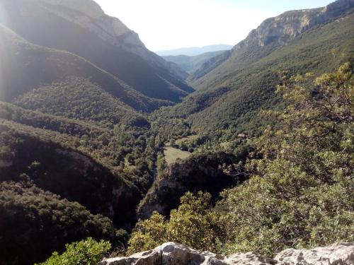 a view of a valley from the top of a mountain at Can Pedragos in Sales del Llierca