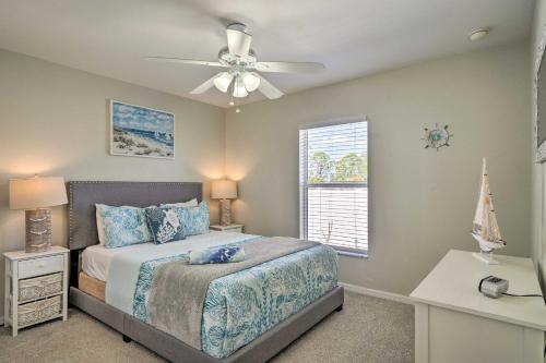 a bedroom with a bed and a ceiling fan at 15 Mi to Beach Home with Pool in Cape Coral in Cape Coral