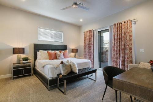 a bedroom with a bed and a living room at Ocotillo Springs 21 Sleeps 22 guests, Fire pit, Community Pool and Hot Tub in Santa Clara