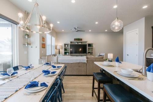 a dining room with a long table and a living room at Ocotillo Springs 2 Includes a Private Hot Tub in Santa Clara