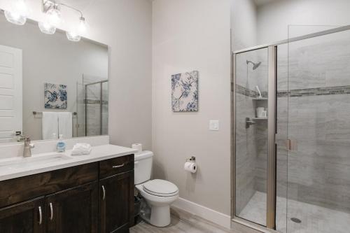 a bathroom with a toilet and a glass shower at Ocotillo Springs 2 Includes a Private Hot Tub in Santa Clara