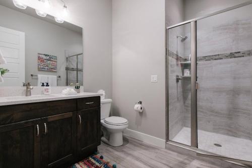 a bathroom with a shower and a toilet and a sink at Ocotillo Springs 2 Includes a Private Hot Tub in Santa Clara