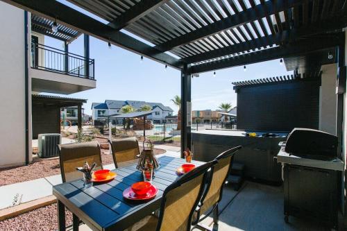 a blue table with chairs on a patio at Ocotillo Springs 2 Includes a Private Hot Tub in Santa Clara