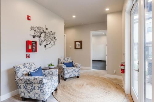 a living room with two chairs and a rug at Ocotillo Springs 2 Includes a Private Hot Tub in Santa Clara