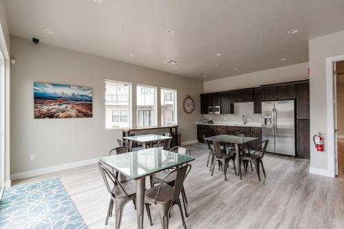 a kitchen and dining room with tables and chairs at Ocotillo Springs 2 Includes a Private Hot Tub in Santa Clara