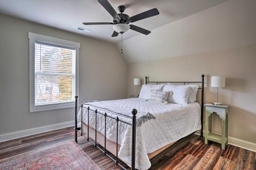 a bedroom with a bed with a ceiling fan at Scenic Mtn Retreat with Wooded Backyard and Fire Pit! in Chattanooga