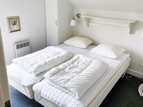 4 star holiday home in Gjern tesisinde bir odada yatak veya yataklar
