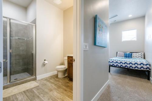 a bathroom with a shower and a toilet and a sink at Ocotillo 69 3 Bedrooms with a Private Hot Tub, Fire Pit, and Private Patio in Santa Clara