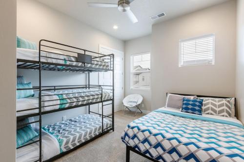 a bedroom with two bunk beds and a bed at Ocotillo 69 3 Bedrooms with a Private Hot Tub, Fire Pit, and Private Patio in Santa Clara