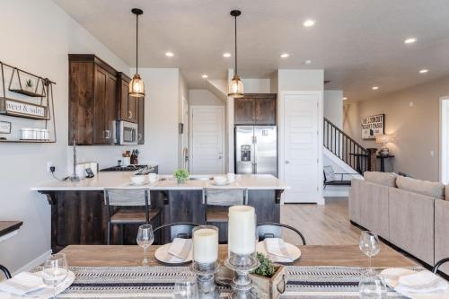 an open kitchen and living room with a table and a couch at Ocotillo 70 Red Mountain View Resort, Private Pool & Hot Tub in Santa Clara