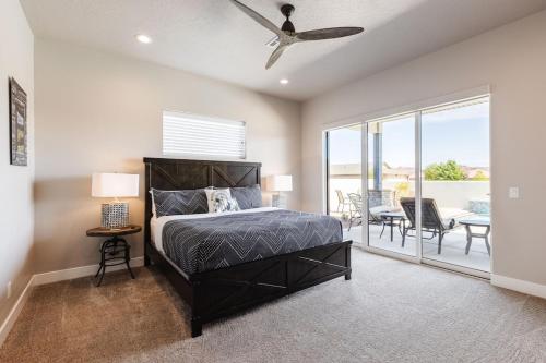 a bedroom with a bed and a ceiling fan at Ocotillo 70 Red Mountain View Resort, Private Pool & Hot Tub in Santa Clara