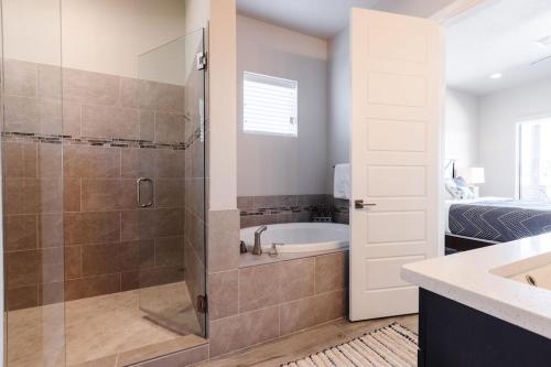 a bathroom with a shower and a sink and a tub at Ocotillo 70 Red Mountain View Resort, Private Pool & Hot Tub in Santa Clara