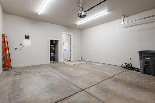 an empty room with white walls and a concrete floor at Ocotillo 70 Red Mountain View Resort, Private Pool & Hot Tub in Santa Clara