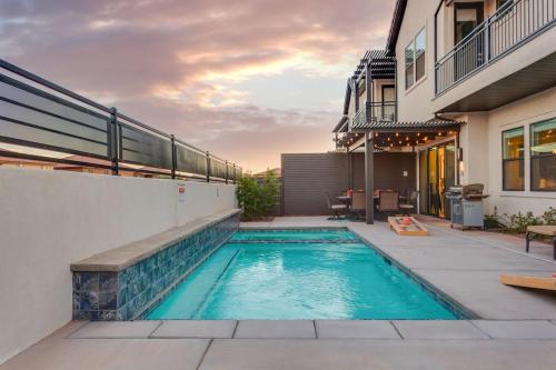 a swimming pool on the side of a house at Ocotillo 70 Red Mountain View Resort, Private Pool & Hot Tub in Santa Clara