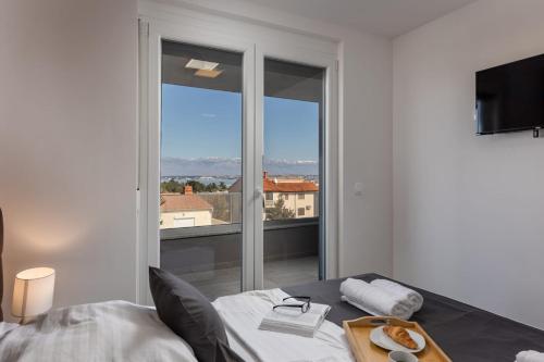 Posteľ alebo postele v izbe v ubytovaní Apartments Cesare