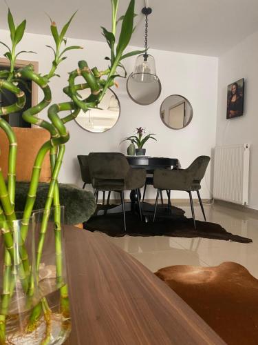 a living room with a table and a dining room at Little John Luxury Apartment in Piraeus