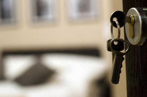 a key is hanging from a door handle at Budapest Ville Bed & Breakfast in Budapest