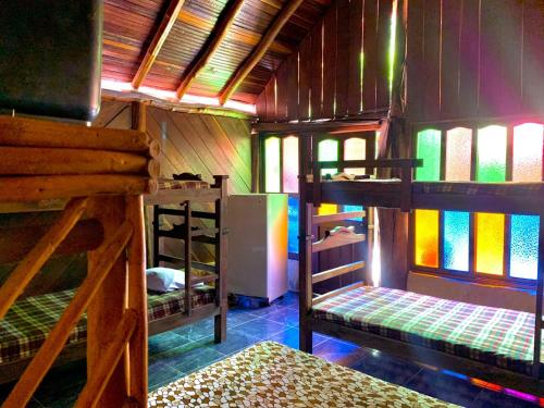 a room with two bunk beds and a refrigerator at EL RODEO in San Gil