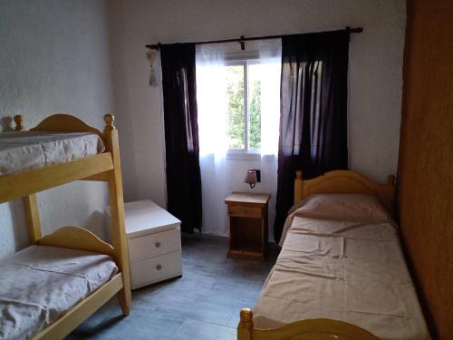 Una cama o camas cuchetas en una habitación  de Villa- Alba