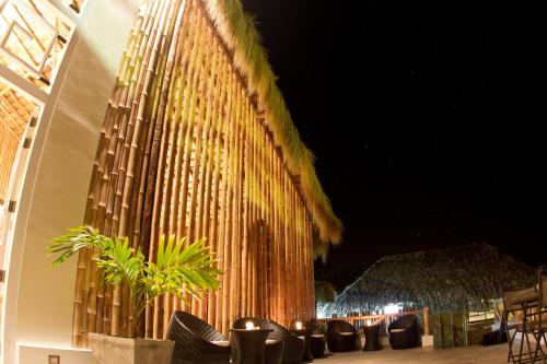 a large building with a bunch of lights on it at Vichayito Bungalows & Carpas by Aranwa Hotels in Vichayito