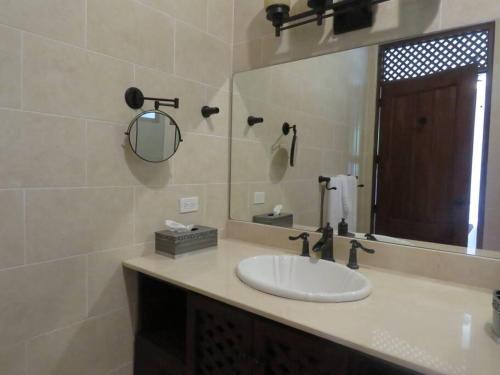 a bathroom with a sink and a mirror at Vista Gaital/ Gaital View in Antón