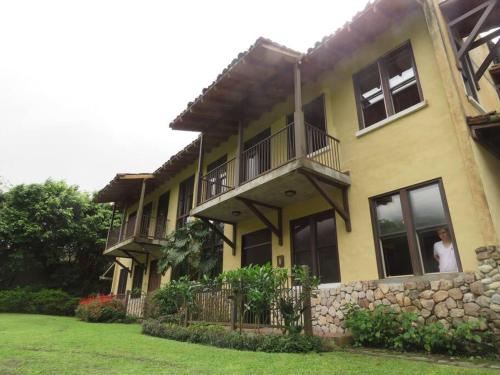 a woman looking out the window of a house at Vista Gaital/ Gaital View in Antón