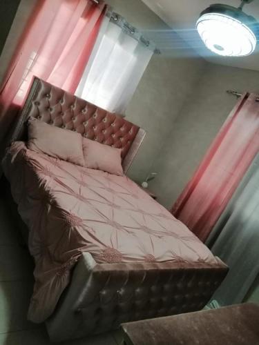 Кровать или кровати в номере Residencial felipe ll