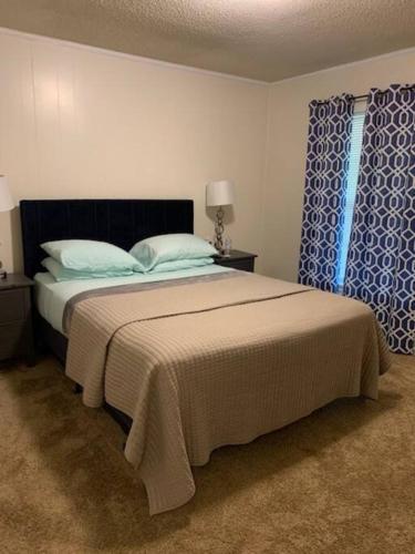 a bedroom with a large bed and a window at Suite 6, Sleep 3, Walk to Attractions in Uptown in Charlotte
