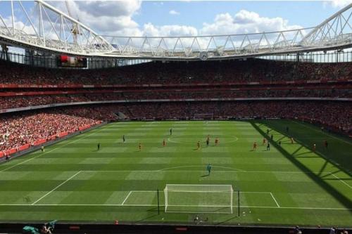 a soccer game is being played in a stadium at Victorian Building turned Charming Hotel Perfect For Short and Long Term Stay with WiFi in London