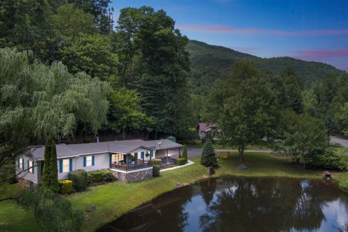 an aerial view of a house with a pond at Twin Ponds Retreats retreat in Whittier