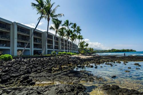 a view of the hotel from the beach at Oceanfront Luxury Condo in Kailua-Kona