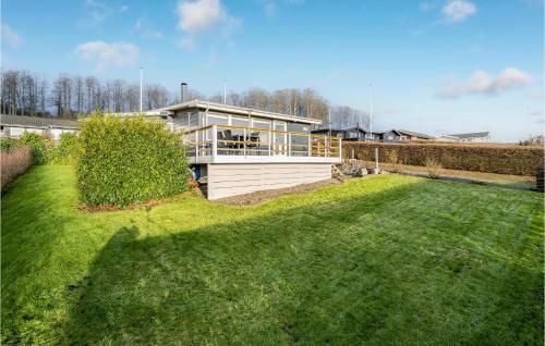 a house with a large lawn in front of it at Amazing Home In Aabenraa in Aabenraa