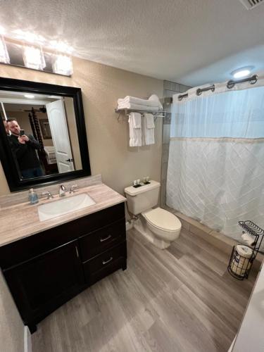 a bathroom with a sink and a toilet and a shower at Lantern Light Inn - Romantic Getaway in Sedona