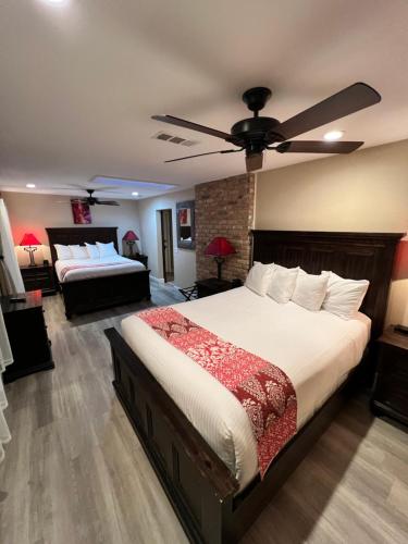 a bedroom with two beds and a ceiling fan at Lantern Light Inn - Romantic Getaway in Sedona