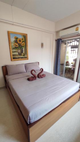 Ένα ή περισσότερα κρεβάτια σε δωμάτιο στο 66 Apartment