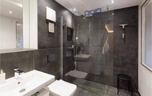 a bathroom with a shower and a sink and a toilet at Princess in Binz
