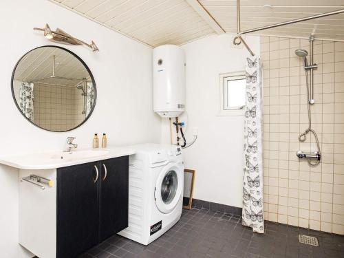 a bathroom with a washing machine and a sink at 8 person holiday home in Vig-By Traum in Vig