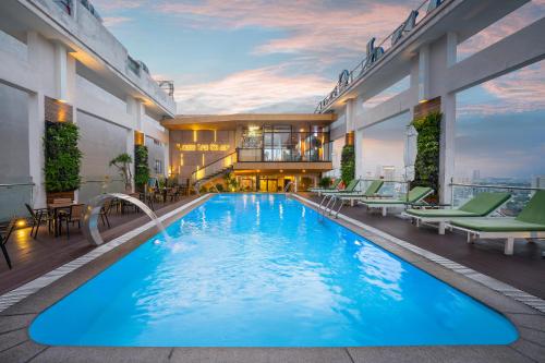 a large swimming pool on the roof of a building at Diamond Sea Hotel in Da Nang