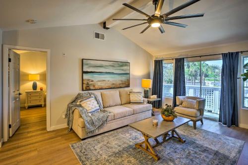a living room with a couch and a ceiling fan at Cozy-Chic Condo Walk to Beach and Park! in Dana Point