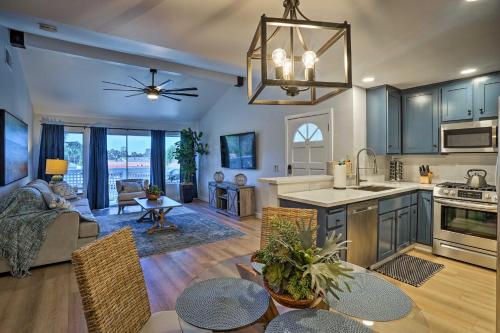 a kitchen and living room with a table and chairs at Cozy-Chic Condo Walk to Beach and Park! in Dana Point
